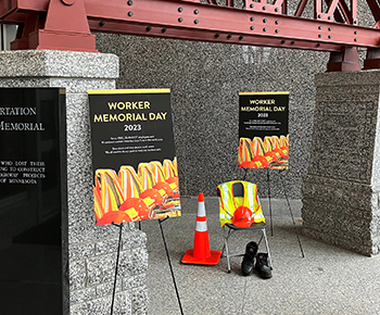 Photo: Empty chair and posters setup for Worker Memorial Day at CO.